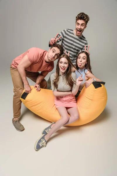 Cheerful Friends Sticking Tongue Out Showing Victory Signs Having Fun — Stock Photo, Image