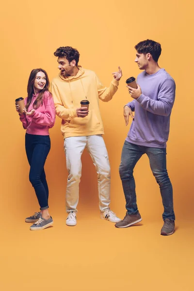 Smiling Friends Having Fun Talking Holding Disposable Cups Coffee Yellow — Stock Photo, Image