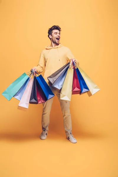 Surprised Man Holding Shopping Bag Yellow — Stock Photo, Image