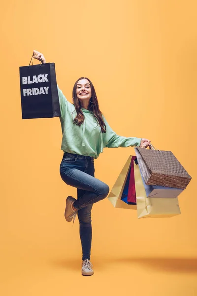 Beautiful Woman Jumping Shopping Bags Black Friday Yellow — Stock Photo, Image