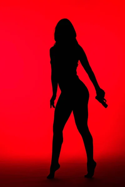 Silhouette Criminal Woman Bodysuit Holding Gun Isolated Red — Stock Photo, Image