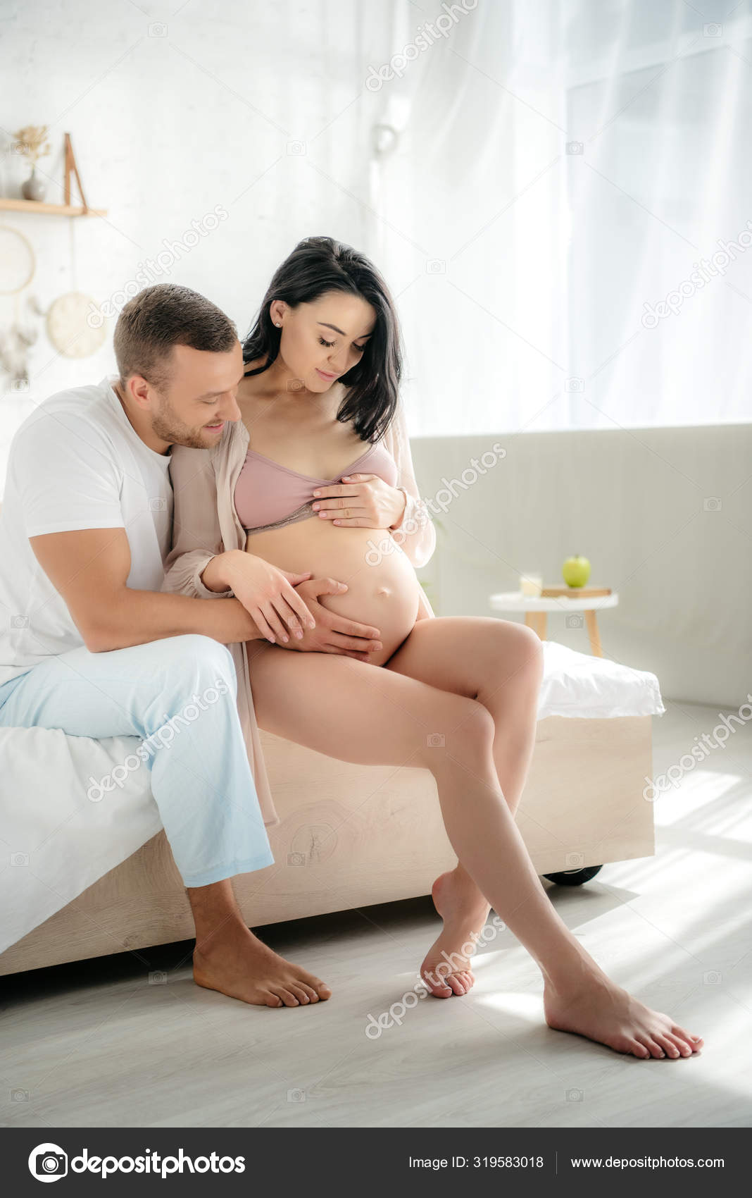 Happy Husband Hugging His Pregnant Wife While Sitting Bed Bedroom Stock Photo by ©HayDmitriy 319583018