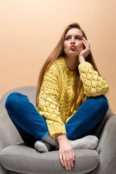 Attractive Thoughtful Woman Yellow Sweater Sitting Armchair Isolated Beige — Stock Photo, Image