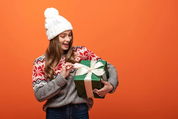 Happy Girl Winter Outfit Holding Present Orange Background — Stock Photo, Image