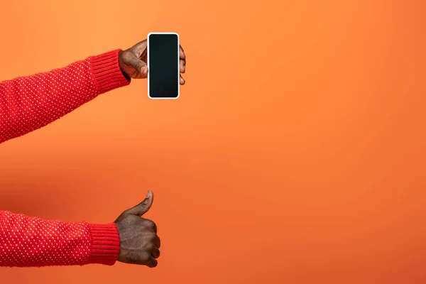 Cropped View African American Man Holding Smartphone Showing Thumb Orange — Stock Photo, Image