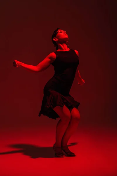 Sensual Dancer Black Dress Performing Tango Dark Background Red Lighting — Stock Photo, Image