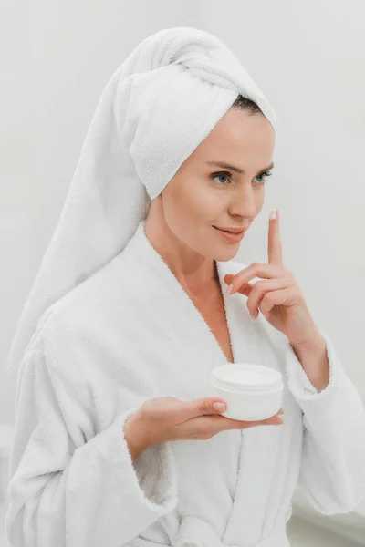 Beautiful Woman Applying Cosmetic Cream Bathroom — Stock Photo, Image