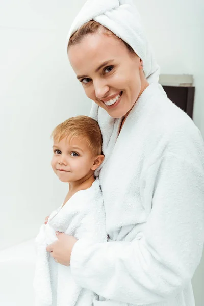 Happy Mother Looking Camera Hugging Toddler Son Bathroom — Stock Photo, Image