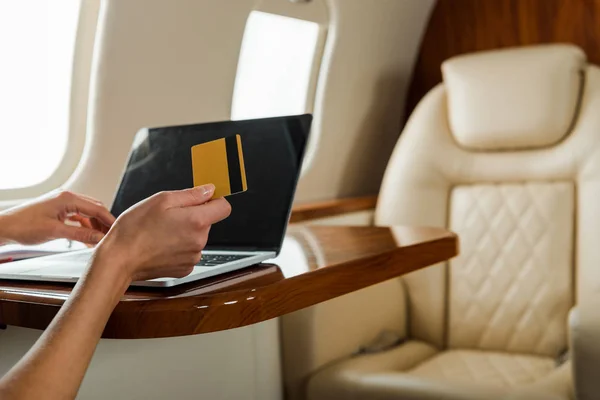 Cropped View Businesswoman Holding Credit Card Laptop Private Plane — Stock Photo, Image