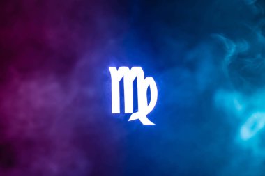 blue illuminated Virgo zodiac sign with colorful smoke on background clipart