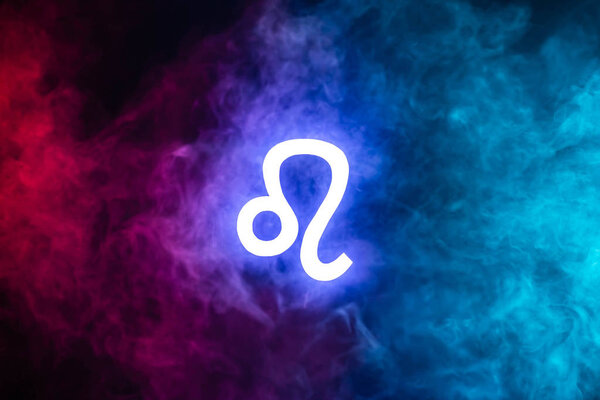 blue illuminated Leo zodiac sign with colorful smoke on background