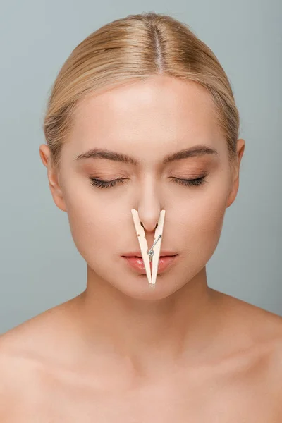 Naked Young Woman Wooden Pin Nose Closed Eyes Isolated Grey — Stock Photo, Image