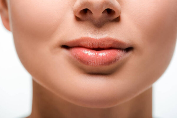 cropped view of woman with lip gloss on lips