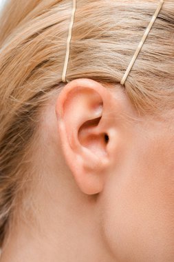 cropped view of young woman with golden hairpins  clipart