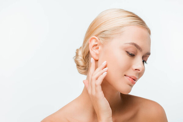 pretty naked woman touching face isolated on white 