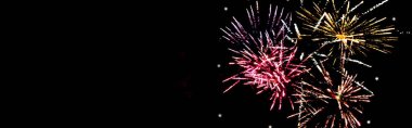 panoramic shot of colorful festive fireworks in night sky, isolated on black clipart