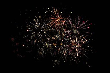 traditional festive fireworks in dark night sky, isolated on black clipart