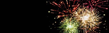 panoramic shot of colorful festive fireworks in night sky, isolated on black clipart