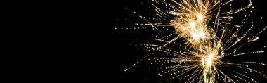 panoramic shot of yellow traditional fireworks in night sky, isolated on black clipart