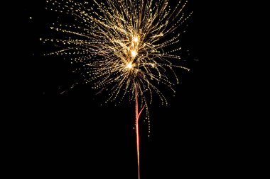 yellow festive fireworks on party, isolated on black clipart