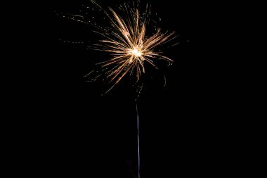 orange firework on party, isolated on black clipart