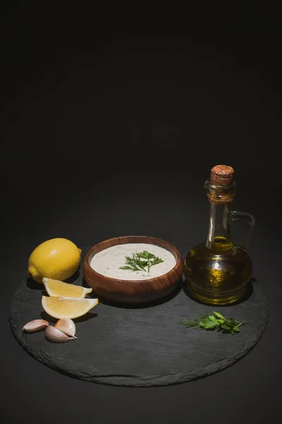 Traditional Greek Tzatziki Sauce Olive Oil Ingredients Dark Board Black — Stock Photo, Image