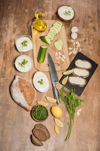 Top View Tzatziki Sauce Ingredients Bread Wooden Table — Stock Photo, Image