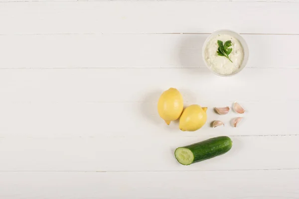 Top View Homemade Tzatziki Sauce Lemons Cucumber Garlic White Wooden — Stock Photo, Image
