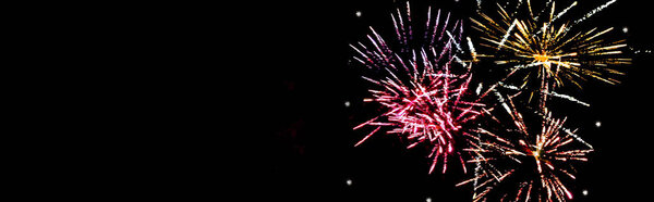 panoramic shot of colorful festive fireworks in night sky, isolated on black