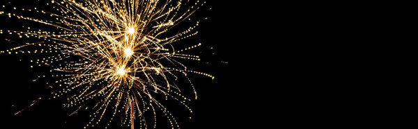 panoramic shot of golden festive fireworks in night sky, isolated on black