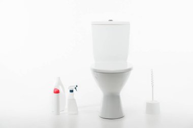 ceramic clean toilet bowl near toilet brush and cleaning supplies isolated on white clipart