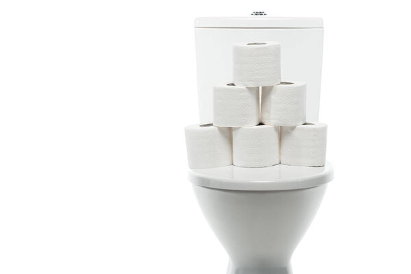 ceramic clean toilet bowl with rolls of toilet paper isolated on white