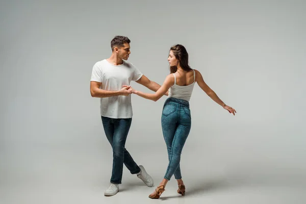 Dancers Denim Jeans Dancing Bachata Grey Background — Stock Photo, Image