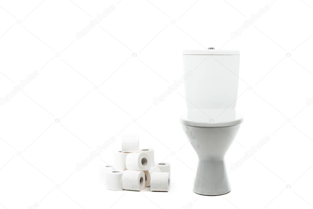 ceramic clean toilet bowl near rolls of toilet paper isolated on white