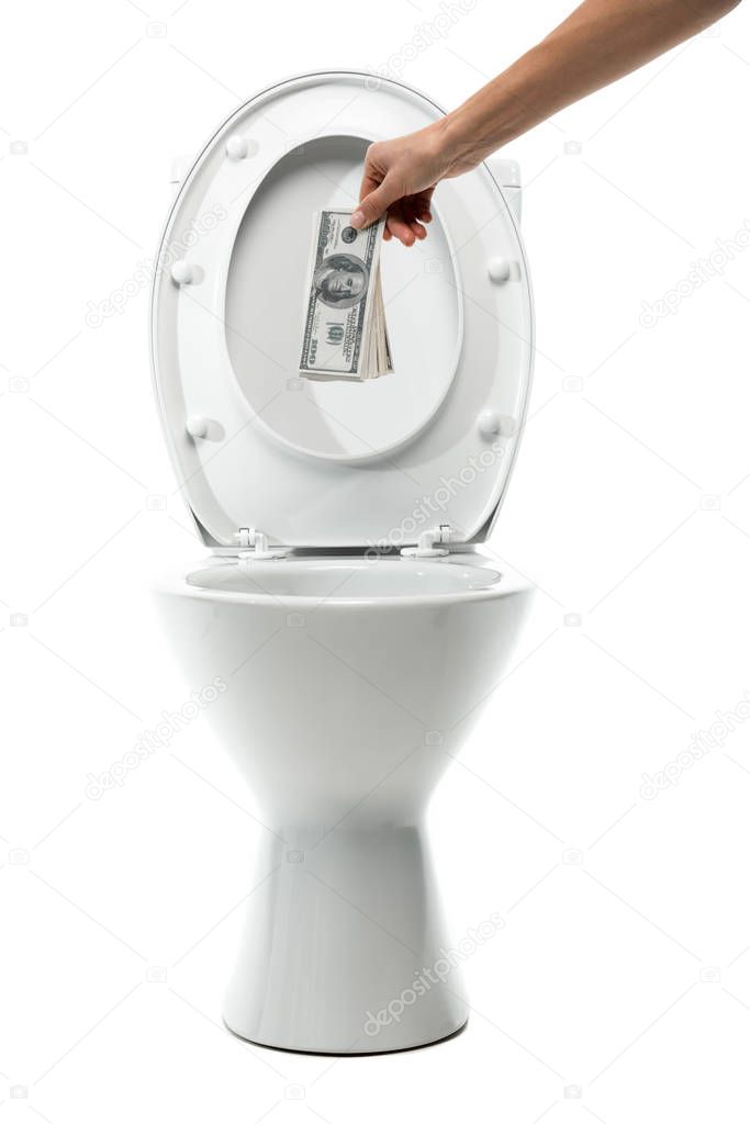 cropped view of woman throwing away money in ceramic clean toilet bowl isolated on white