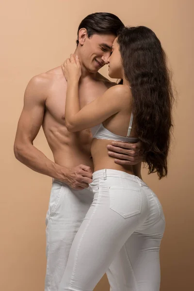 Smiling Shirtless Man Hugging Sensual Woman White Bra Isolated Beige — Stock Photo, Image