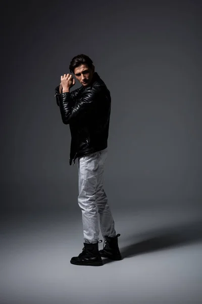 Young Man White Jeans Black Leather Jacket Grey Royalty Free Stock Photos