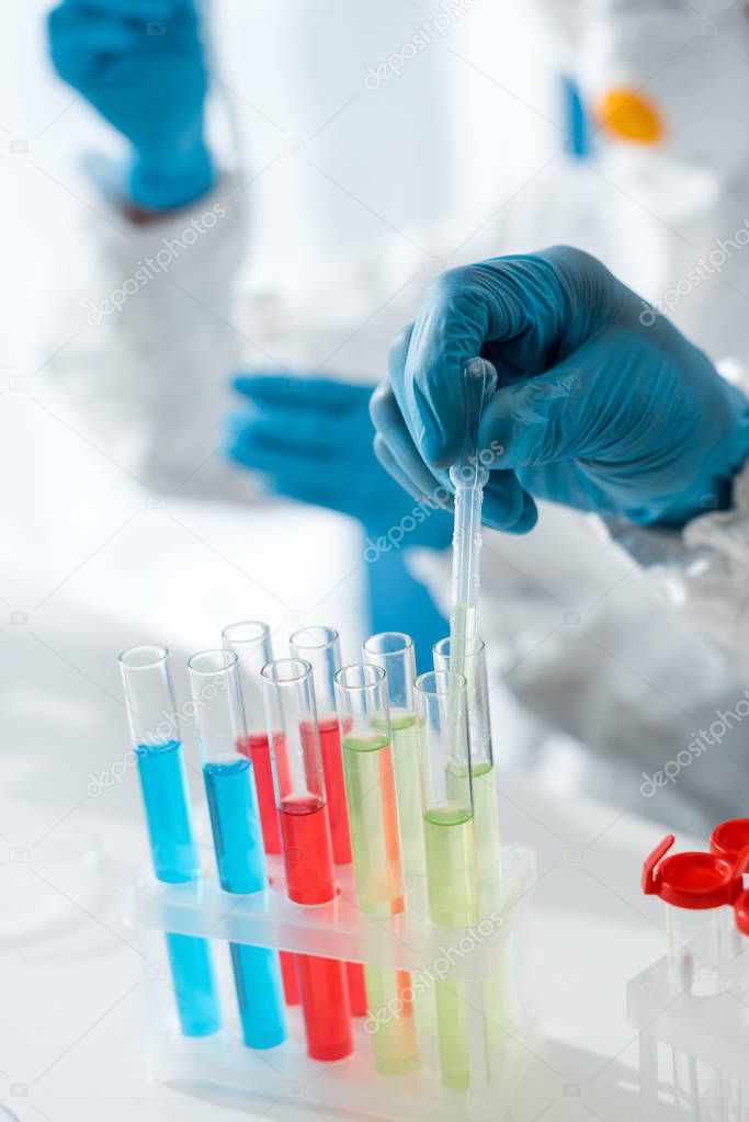 cropped view of scientists doing dna test in lab 