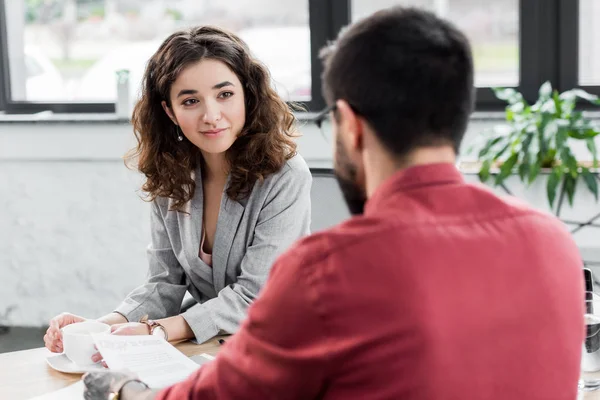 Selective Focus Smiling Account Manager Holding Cup Looking Colleague — Stock Photo, Image