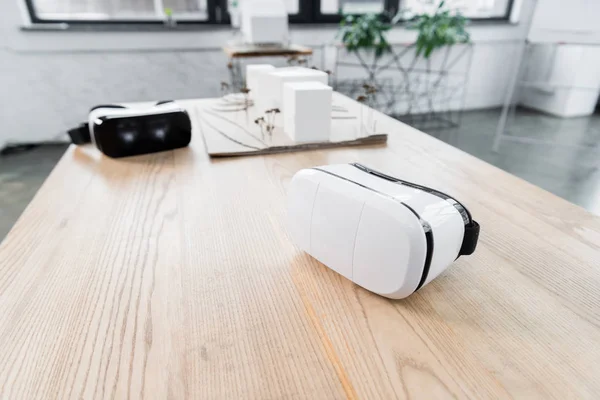 selective focus of virtual reality headset on wooden table