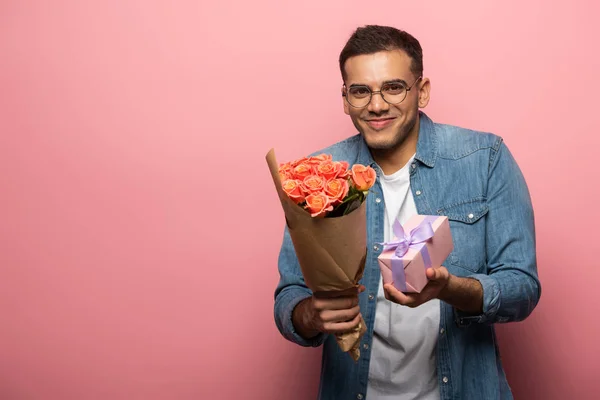 Young Man Smiling Camera While Holding Present Bouquet Pink Background — Stock Photo, Image