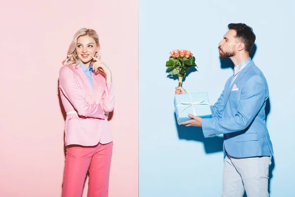 Handsome Man Giving Dreamy Woman Bouquet Gift Pink Blue Background — Stock Photo, Image