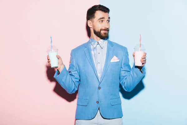 Smiling Man Holding Cocktails Pink Blue Background — Stock Photo, Image