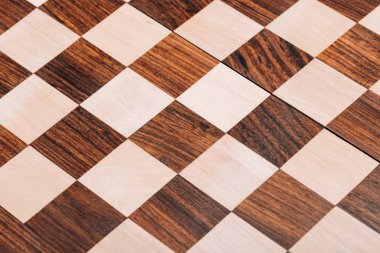 Surface of folding wooden checkerboard with brown and white squares clipart