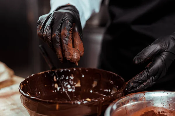 Cropped View Chocolatier Black Latex Glove Holding Chocolate Ball Bowl — Stock Photo, Image