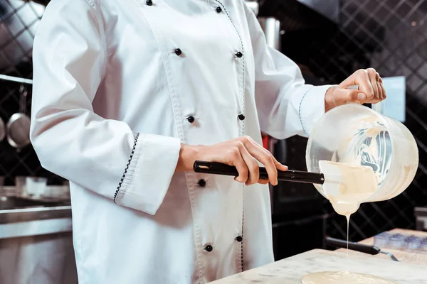 Cropped View Chocolatier Holding Silicone Spatula While Pouring Melted White — Stock Photo, Image
