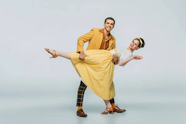 Handsome Dancer Supporting Partner While Dancing Boogie Woogie Grey Background — Stock Photo, Image