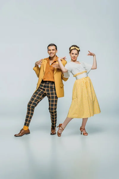 Cheerful Dancers Looking Camera While Dancing Boogie Woogie Grey Background — Stock Photo, Image