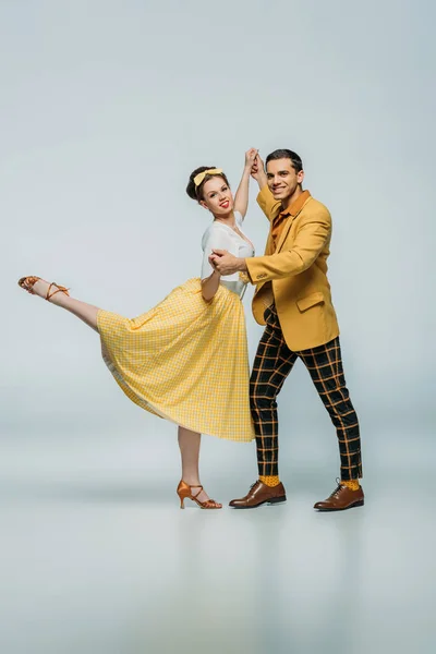 Stylish Dancers Holding Hands While Dancing Boogie Woogie Grey Background — Stock Photo, Image