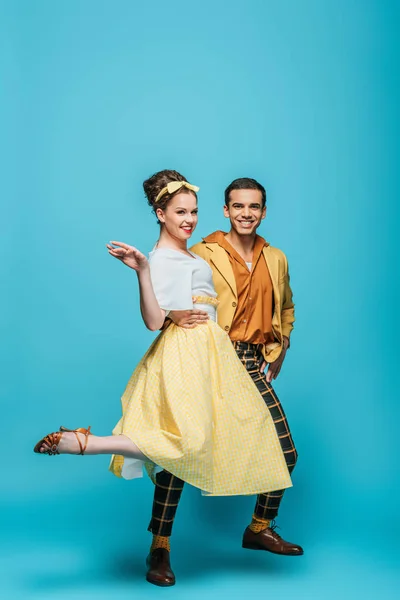 Happy Dancers Looking Camera While Dancing Boogie Woogie Blue Background — 스톡 사진
